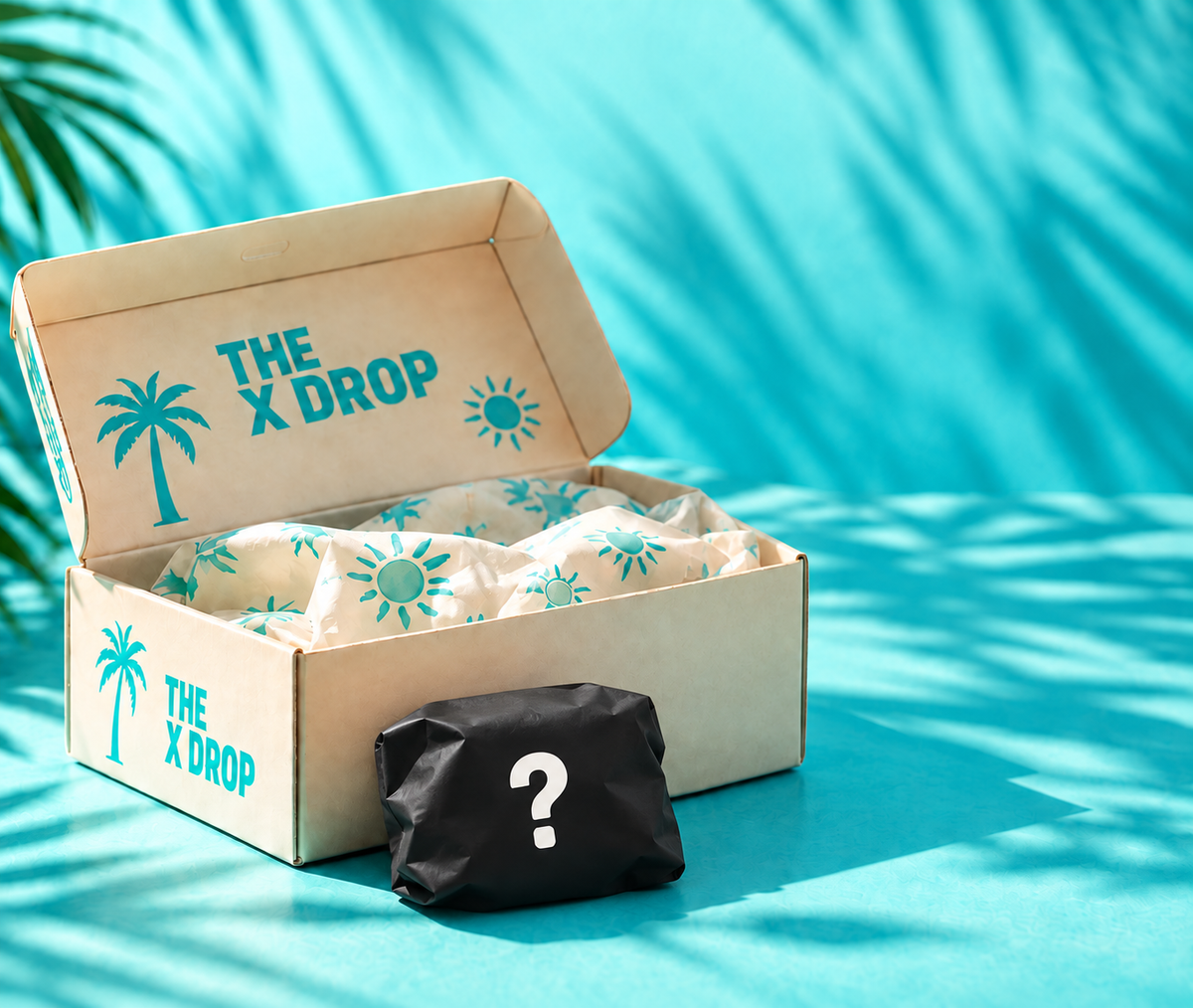 Caja THE X DROP y paquete de misterio opaco. Contenido real solo en la descripción.